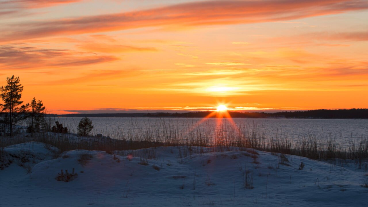 The sun sets over the northern shores